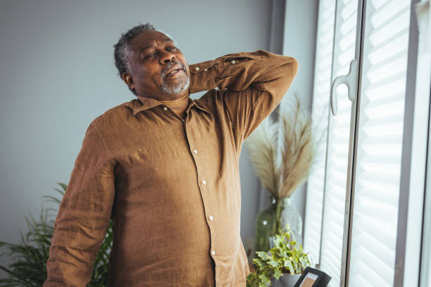 istock An older man suffers from back pain. 1372116450