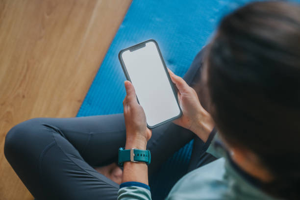 istock Woman using cellphone at home 1372117483