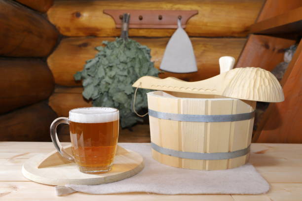 a mug of light beer in sauna. - wooden hub imagens e fotografias de stock