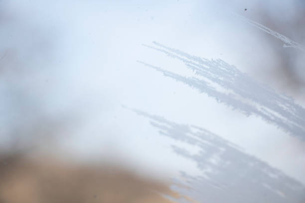 istock Frozen window and glass, frozen dew water pattern and texture 1372118062