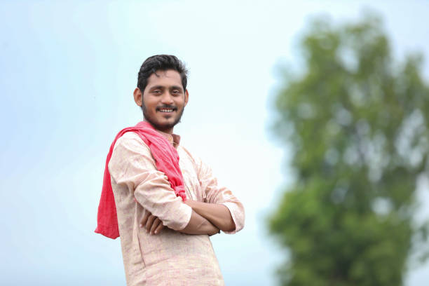 istock indian farmer standing at agriculture field. 1372119539