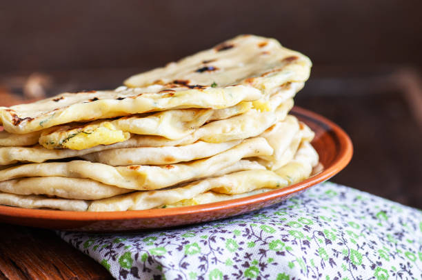 savory pastry; gozleme; Khychin - traditional flatbreads stuffed with mashed potatoes and greens. flatbread stock pictures, royalty-free photos & images