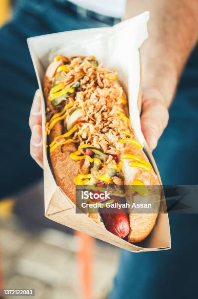 Freshly Prepared Hotdog With Lush Salsa Cauce In A Paper Box Food Delivery Or Take Away Food Concept Stock Photo - Download Image Now