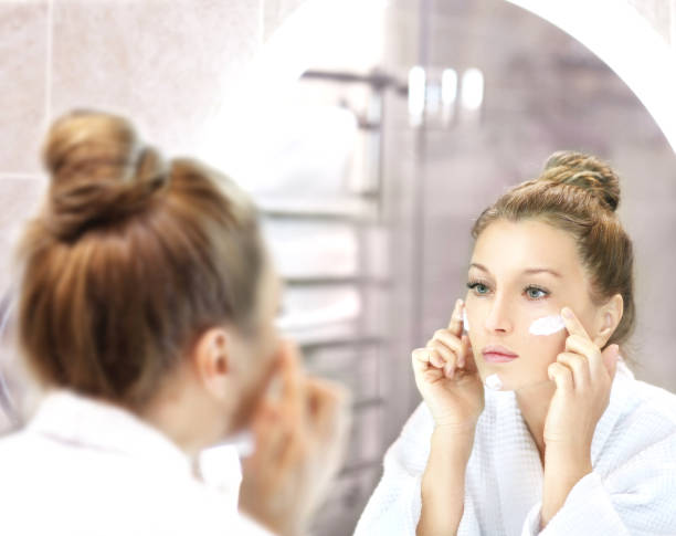 istock Applying the cream.Magic anti-aging cream. 1372122356