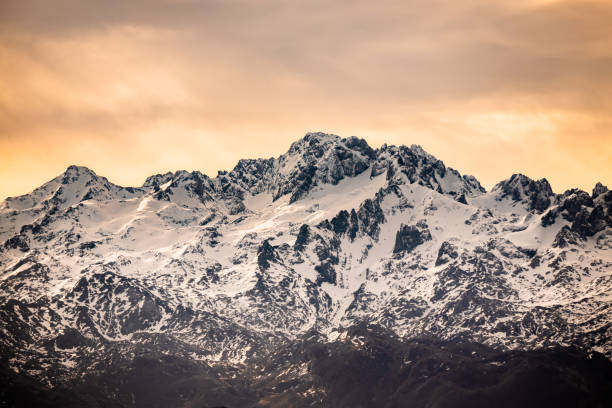 istock Sunrise over Snow capped mountains 1372122404