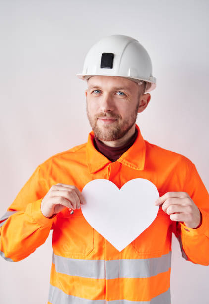 istock Supervisor in vest with heart as Construction Day concept 1372123231