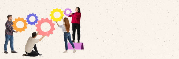 istock Creative design. Employees, office workers connecting puzzle gears symbolizing successful and well-coordinated work 1372123851