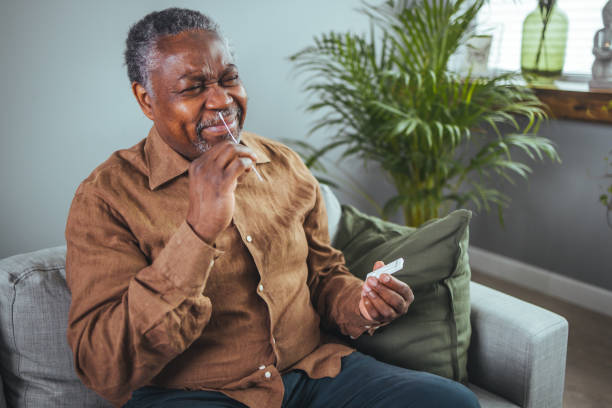 istock Coronavirus self test at home. senior man performs a covid-19 quick test at home. 1372124617