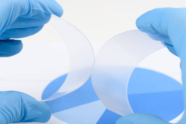 istock Scientist hold and bend two pieces of flexible transparent plastic like polymer material in laboratory 1372124665