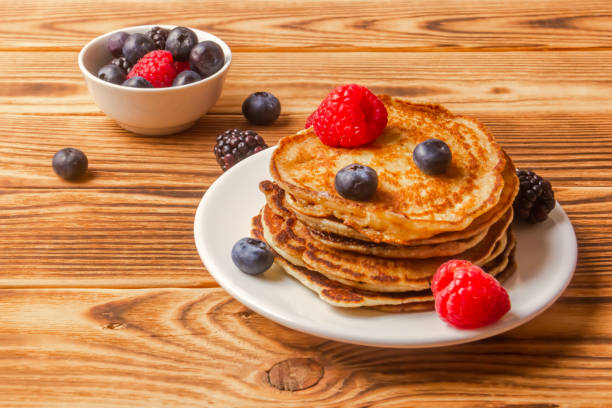 istock Pancakes And Berries On Wooden Background 1372125421
