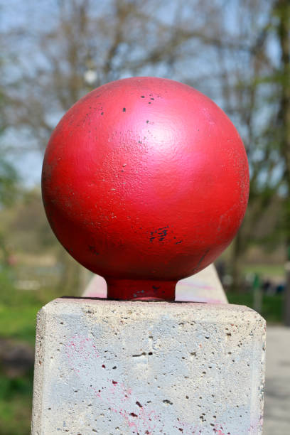istock Red stone ball on a bridge railing, Germany, Europe 1372125472