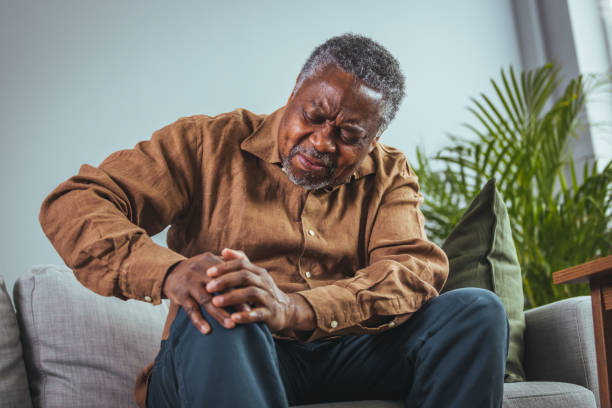 istock Mature man massaging his painful knee. 1372125554