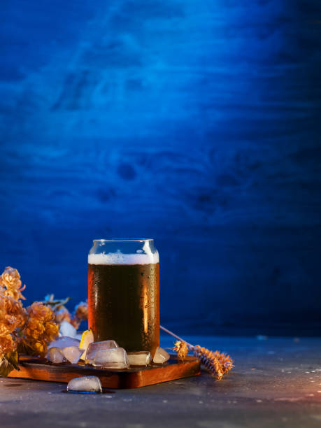 istock glass of cold beer, blue background 1372125570