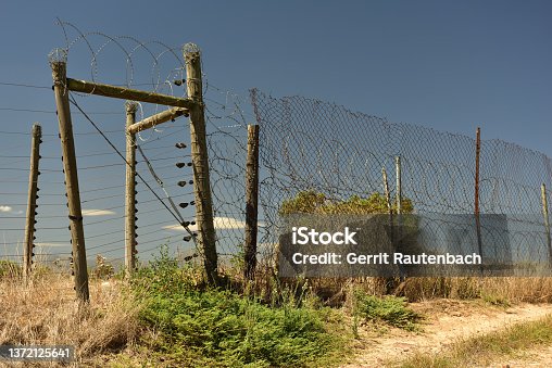 istock Electrical and razorblade fencing to help safeguard farmland 1372125641