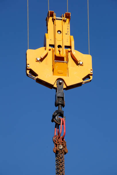 istock Orange cargo hook with carabiner on a crane 1372126252
