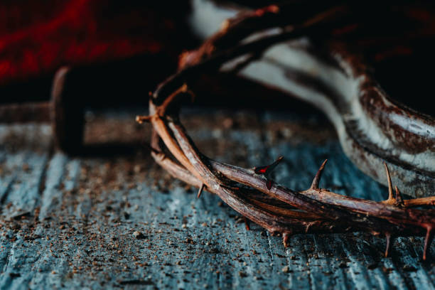 istock nail and crown of thorns with fresh blood 1372126465