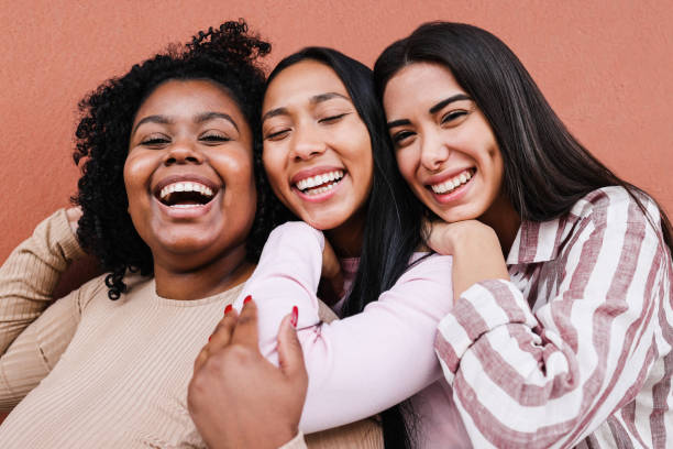 istock Multiracial friends having fun together outdoor - Focus on faces 1372126587