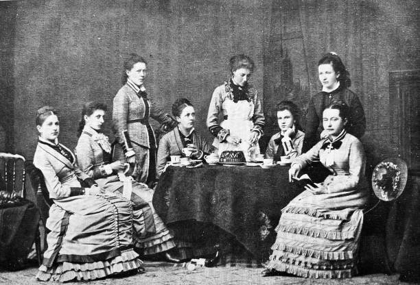 istock Ladies' party 1885. women sitting around a table 1372126789