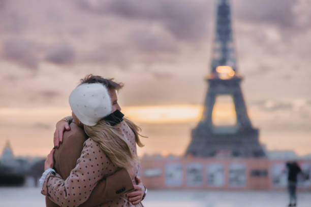 istock Close-up, young couple hugging each other in front of Eiffel Tower, Paris 1372127056