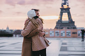 Romantic Couple hugging each other at Parvis des Droits de l'Homme in front of Eiffel Tower, Paris