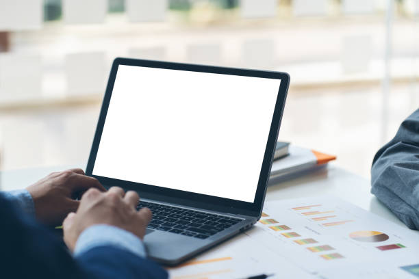 istock Close-up image of a male assistant working on laptop computer at her workspace. laptop blank screen mockup. 1372128020