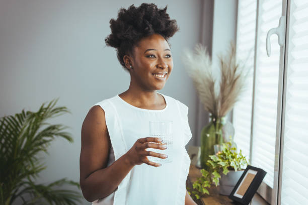 istock Smiling sincere african lady feeling energetic and refreshed alone indoors 1372128150