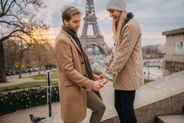 istock Man going down on his knees to propose his girlfriend in front of Eiffel Tower, Paris 1372128466