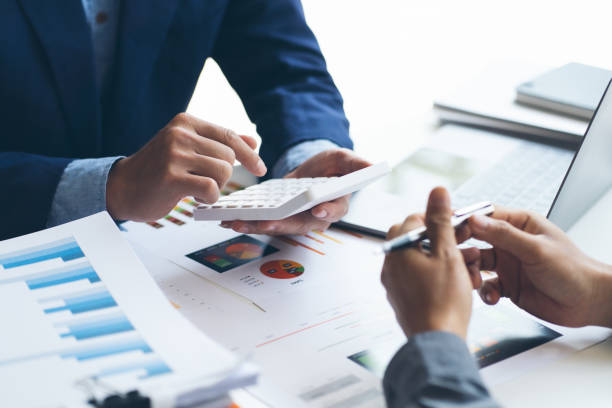 istock working together in office concept, young businessmen using touchpad digital tablet to discuss the situation on the market or stock yield graph chart at meeting office 1372132806