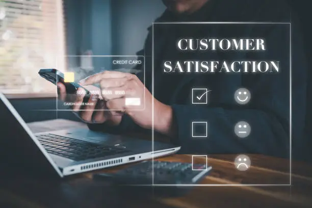 Photo of Customer Survey Feedback and Satisfaction Service Concept. Woman's Hands is Choosing Rate of Satisfaction Evaluation for Customers Service. Product Questionnaire for Customer Satisfied Feedback.