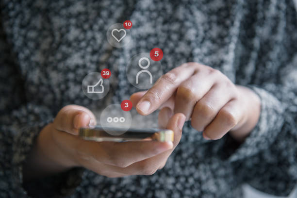 istock Social Media and Technology Internet Communication Connection Concept. Business Woman's Hands is Using Social Media Via Smartphone With Notification Icon. Technology Digital Media Mobile Phone Network 1372134487