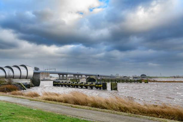 Inflatable rubber dam balgstuw at Ramspol in inflated state. The Balgstuw dam at Rampsol can be inflated during storms stopping water from the Ketlemeer going in the Zwarte Meer between Flevoland and Overijssel in The Netherlands.