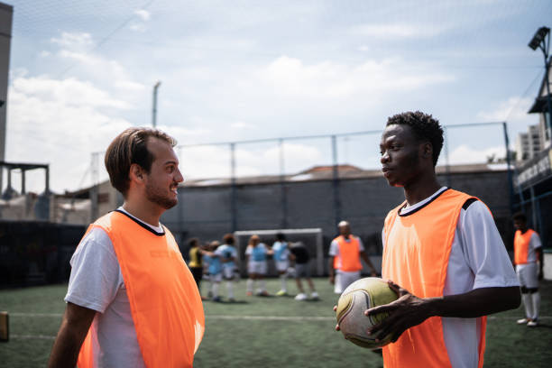 istock Players talking on the soccer field 1372135589