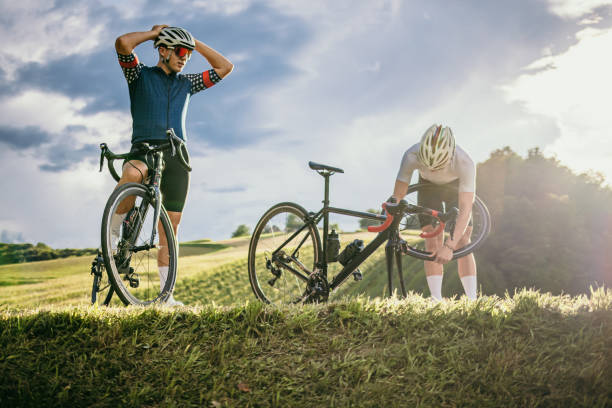 istock Cyclist repairing flat tyre during training 1372136272