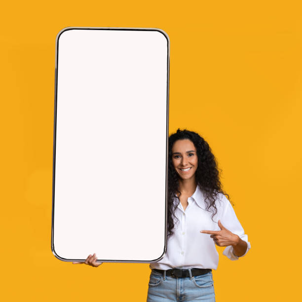 istock Excited lady pointing at white empty smartphone screen 1372138301