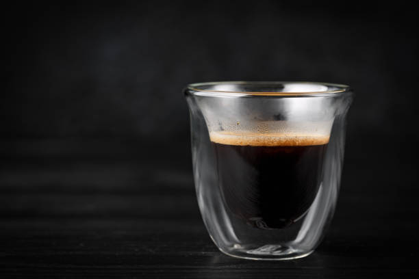 istock Hot freshly brewed espresso coffee in a double walled shot glass 1372138616