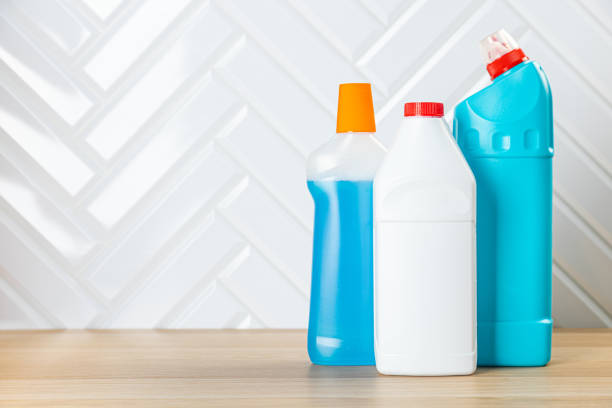 istock cleaning product on a colored background side view. Professional cleaning products, spring cleaning. Household chemicals 1372140933