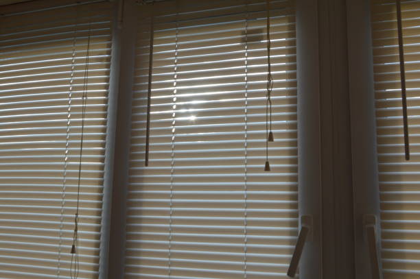istock Horizontal blinds shine sunlight into the room 1372141314