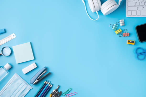 istock Online learning and back to school design concept. Top view of student table with headphone and stationery. 1372141593
