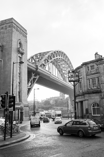 Newcastle upon Tyne England - 29th Oct 2018: Tyne Bridge on a foggy winter morning in moody black and white. With traffic passing by