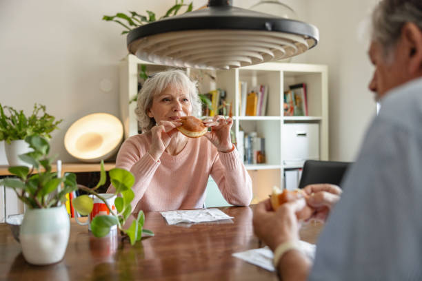 istock Senior Couple Talking In The Kitchen 1372142797
