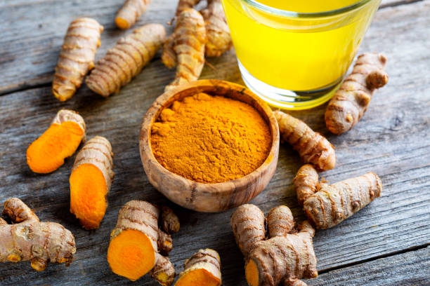 istock Curcuma longa, powder and rhizomes 1372144893