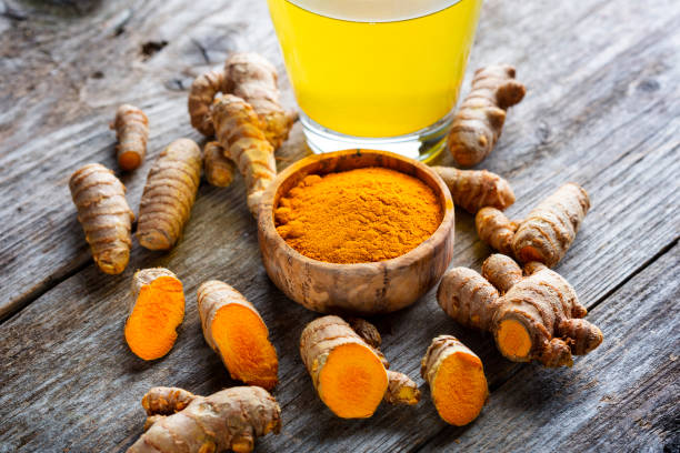 istock Curcuma longa, powder and rhizomes 1372144920