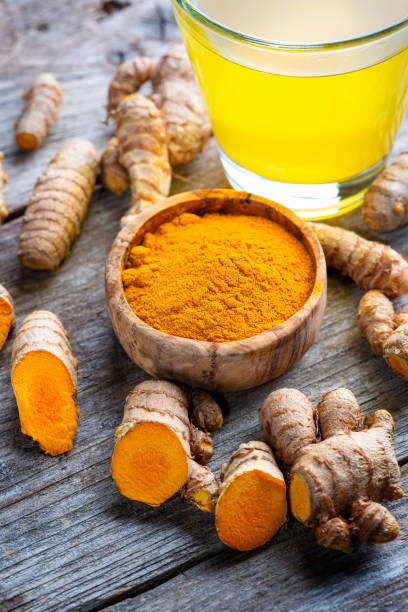 istock Curcuma longa, powder and rhizomes 1372144962