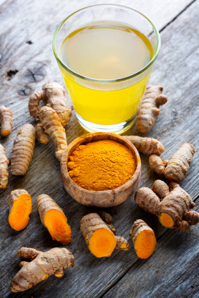 istock Curcuma longa, powder and rhizomes 1372144977