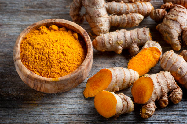 istock Curcuma longa, powder and rhizomes 1372145004