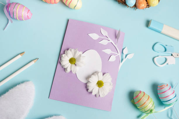 istock Diy Easter card from paper. Volume greeting card with egg on blue background. Gift idea, decor Spring, Easter 1372145114