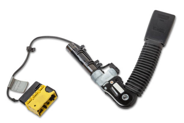 The lock of a seat belt of a car of forward sitting with the panel for a fastening bolt and squib a plastic case of black color with red unlock keys. Spare part for replacement during repair or sale. la cerradura de un cinturón de seguridad de un coche de adelante sentado con el panel para un perno de sujeción y squib una caja de plástico de color negro con llaves de desbloqueo rojas. repuesto para reemplazo durante la reparación o venta.