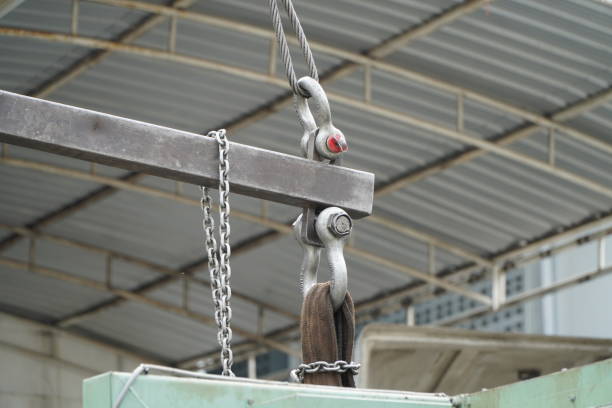 istock Crane boom with isolated hook, blue sky background,Elements of crane: hook, loop, chain, connecting parts 1372145954