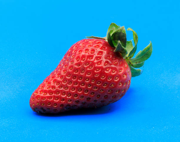 istock Fresh red ripe strawberry isolated on white, macro image 1372147376