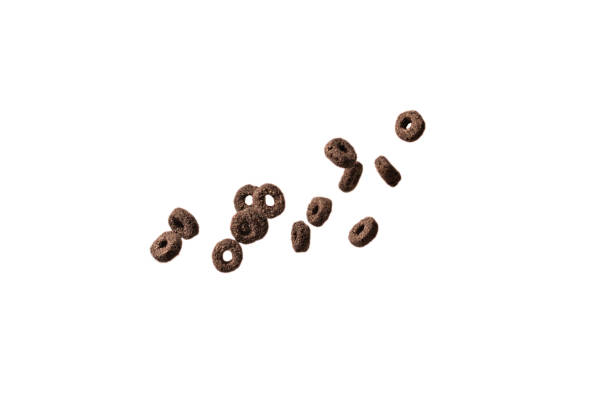 istock Chocolate rings cereal spill out into a bowl. Breakfast. 1372147515